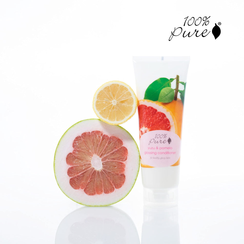 Texture closeup reveals a silky finish from 100% PURE Yuzu & Pomelo Glossing Conditioner.