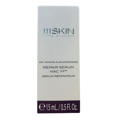 111SKIN NAC Y2 travel-size bottle in hand for on-the-go care.