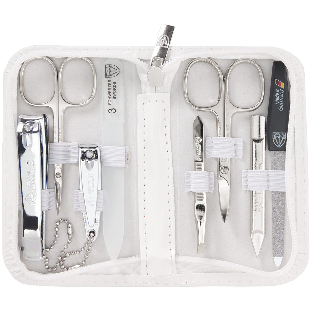 3 Swords Germany eight-piece kit in white leather case for travel grooming