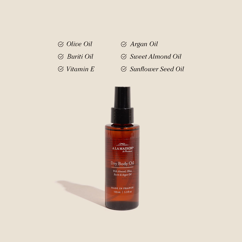 A LA MAISON bottle close up highlights sweet almond oil for nourishing skin.