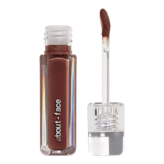 about-face Light Lock Lip Gloss Adore Me bottle showing a glossy, non-sticky shine.