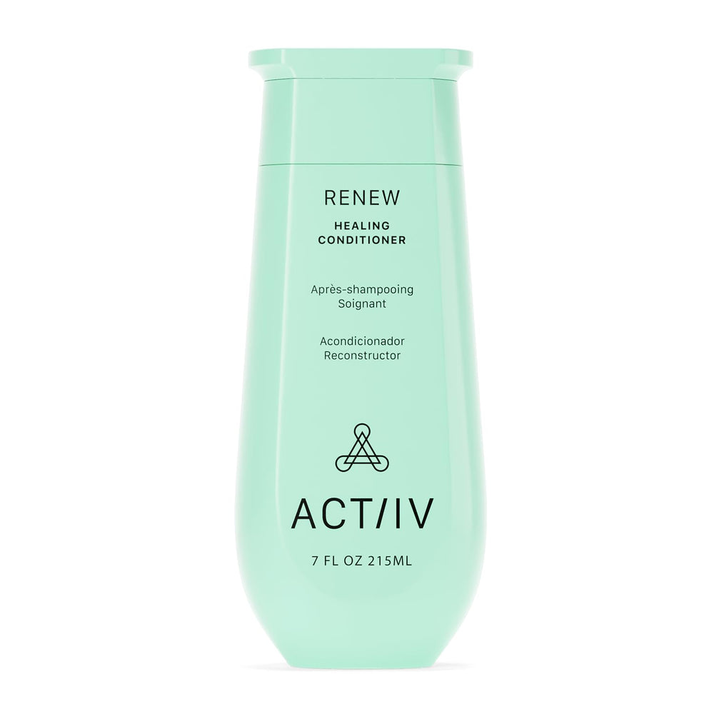 ACTIIV Renew Healing Conditioner bottle on bathroom shelf offers hydration for all hair types.