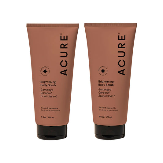 Acure Brightening Body Scrub bottle with sea salt for smooth, radiant skin.