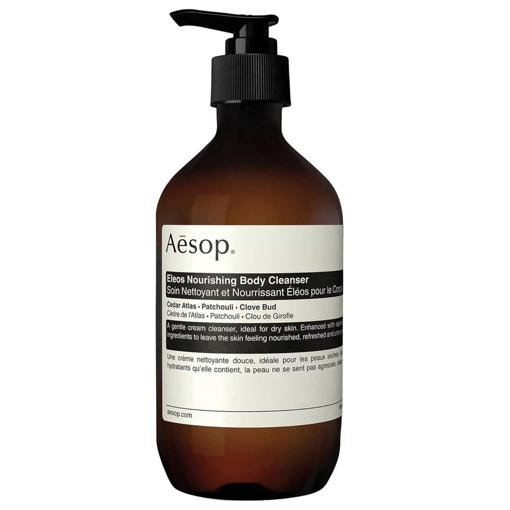 Aesop Eleos Nourishing Body Cleanser bottle pouring a gentle cream lather for hydrated skin