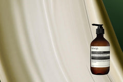 Aesop Geranium Leaf Body Balm being massaged into skin