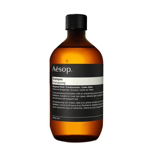 Aesop Shampoo Refill bottle pour demonstrates easy dispensing and eco-friendly design.