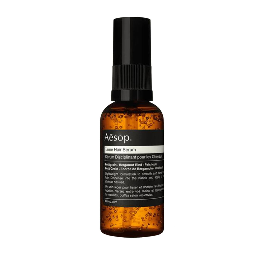 Aesop Tame Hair Serum bottle with pump for controlled smoothing.