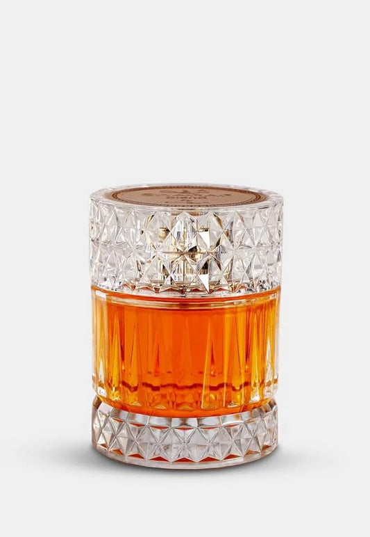 Afnan Macarena Sharaf Blend bottle presented with warm spices for elegant evening wear.