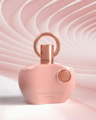 Afnan Supremacy Pink 3.4 oz bottle on vanity, inviting everyday elegance