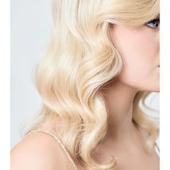 AIIR Shine Spray with Reflect enhances color depth and radiance.