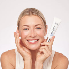 Applying Alastin Ultra Light Daily Moisturizer on face and neck supports daily hydration.