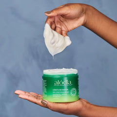 ALODIA Deep Conditioning Masque applied to curly hair for detangling and moisture.