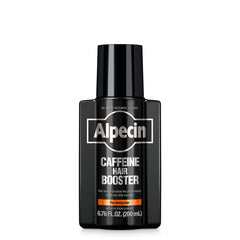 Alpecin Caffeine Hair Booster bottle pour with new fragrance for refreshing scalp routine.