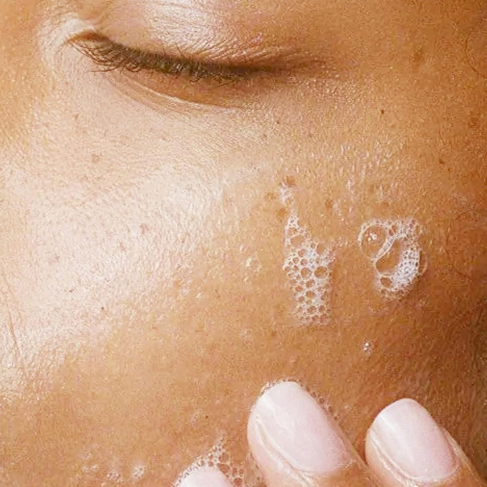 Close-up of Alpha Skin Care Refreshing Face Wash being applied to skin for a refreshing cleanse.