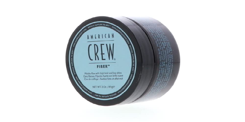 Rubbing American Crew Men Fiber between hands to activate texture.