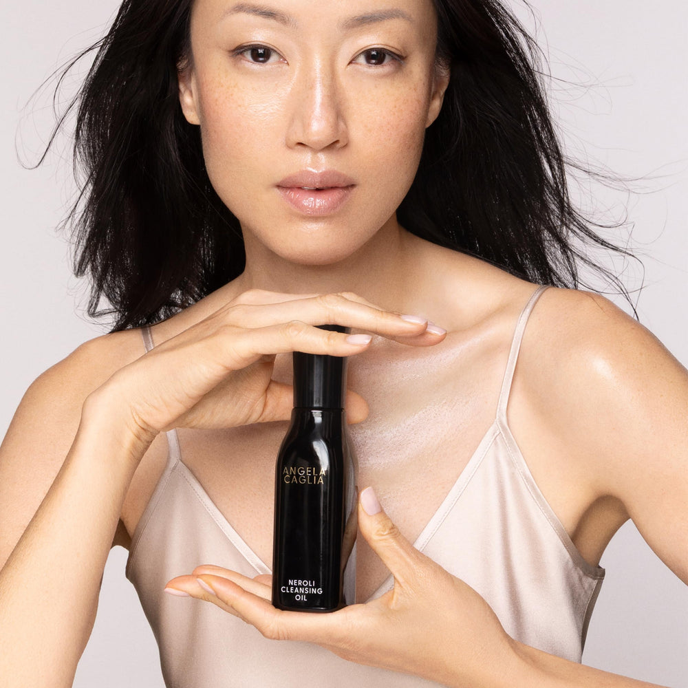 Angela Caglia Neroli Cleansing Oil close-up highlights spa-like ritual for calm skin.