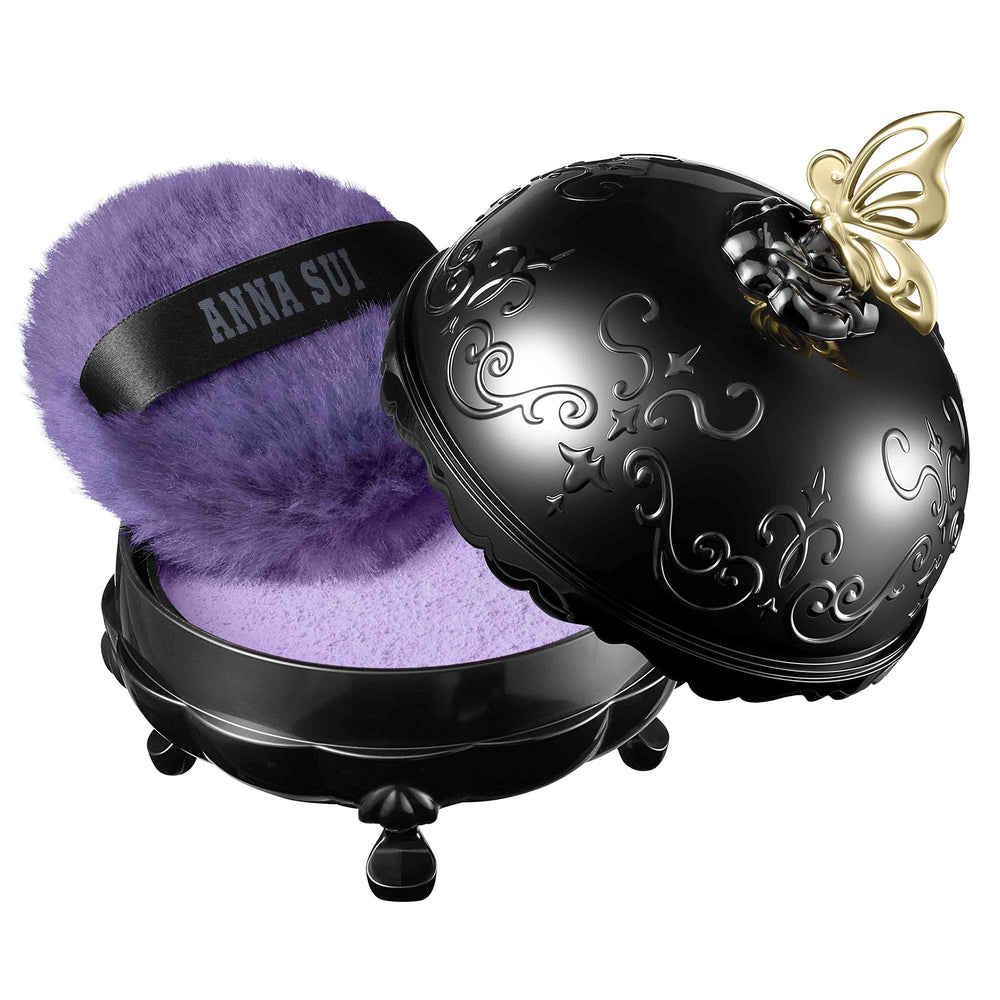 ANNA SUI brightening powder enhances radiance without heaviness.