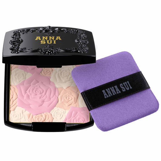 ANNA SUI Rose Pressed Powder compact with a rose-design interior for a silky, radiant finish.