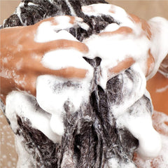 Anomaly Clarifying Shampoo foamy lather demonstrating buildup removal