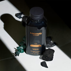 Anomaly Clarifying Shampoo label closeup showing vegan and clean formula