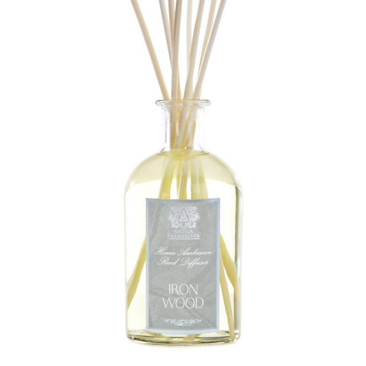 Antica Farmacista diffuser bottle with reeds showcasing elegant ironwood scent diffusion