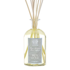 Antica Farmacista diffuser bottle with reeds showcasing elegant ironwood scent diffusion
