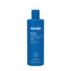 Aquage SeaExtend Silkening Shampoo bottle on a bathroom shelf for smooth, shiny hair.