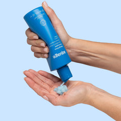 Product shot of Aquage Weightless Detangler, portable 8 oz bottle for travel.