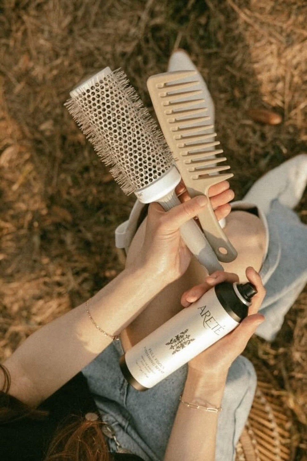 ARETÉ travel-size finishing spray ready for on-the-go styling.