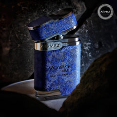 Armaf Voyage Blue flatlay, bottle with natural-toned styling.
