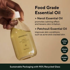 AROMATICA Embrace Body Oil after-shower application on arm for quick absorption.