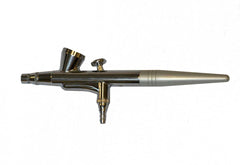 Art of Air compressor and airbrush combo in-use with accessories for precise cosmetic application.