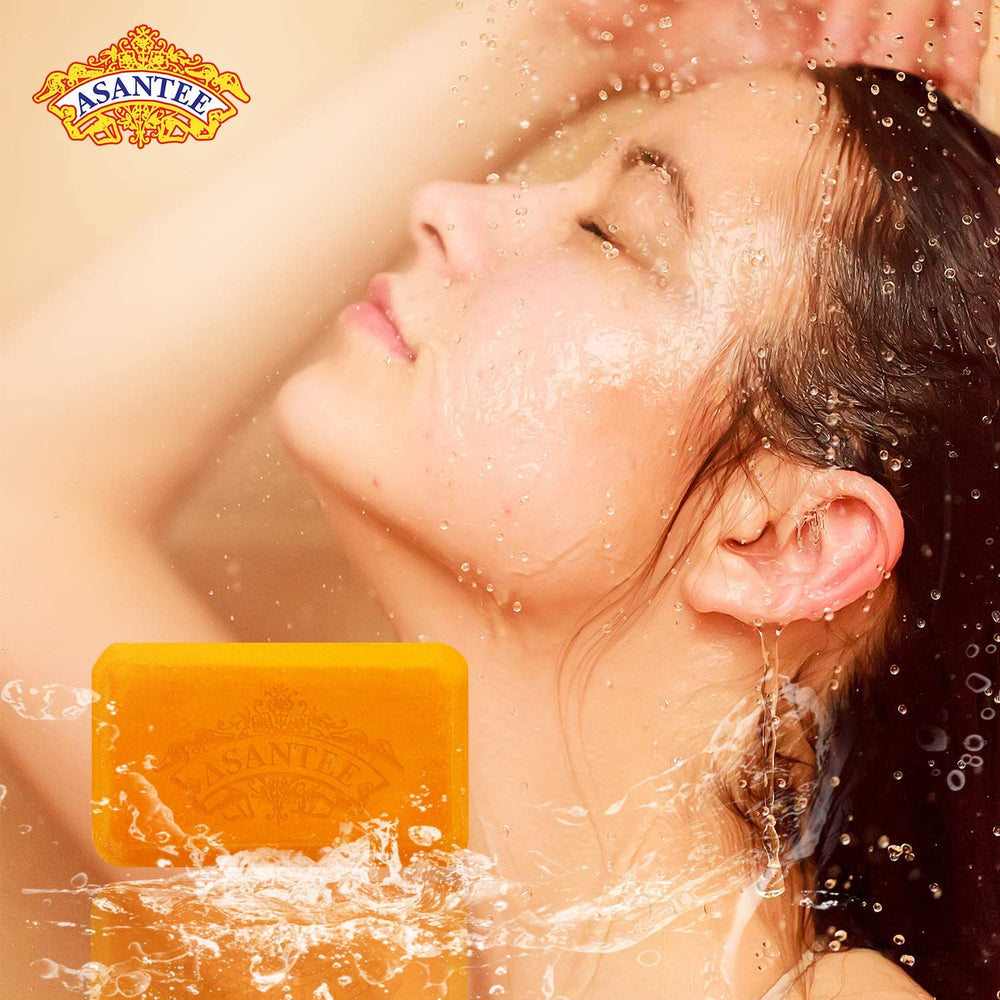ASANTEE Papaya & Honey soap bar in sunlight suggesting radiant skin.