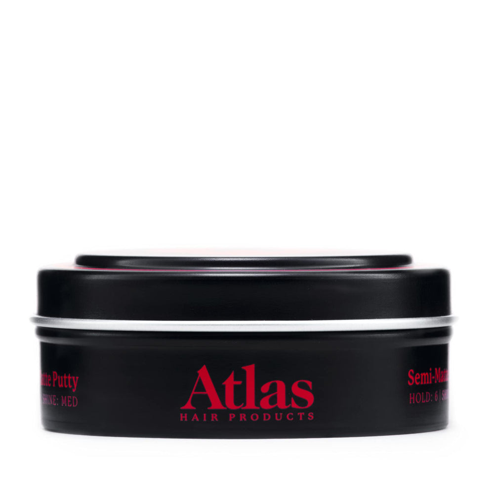 Atlas Pomade being applied to wet hair delivers firm hold.