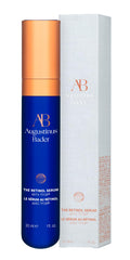 Premium cap detail on Augustinus Bader serum signaling luxury packaging.