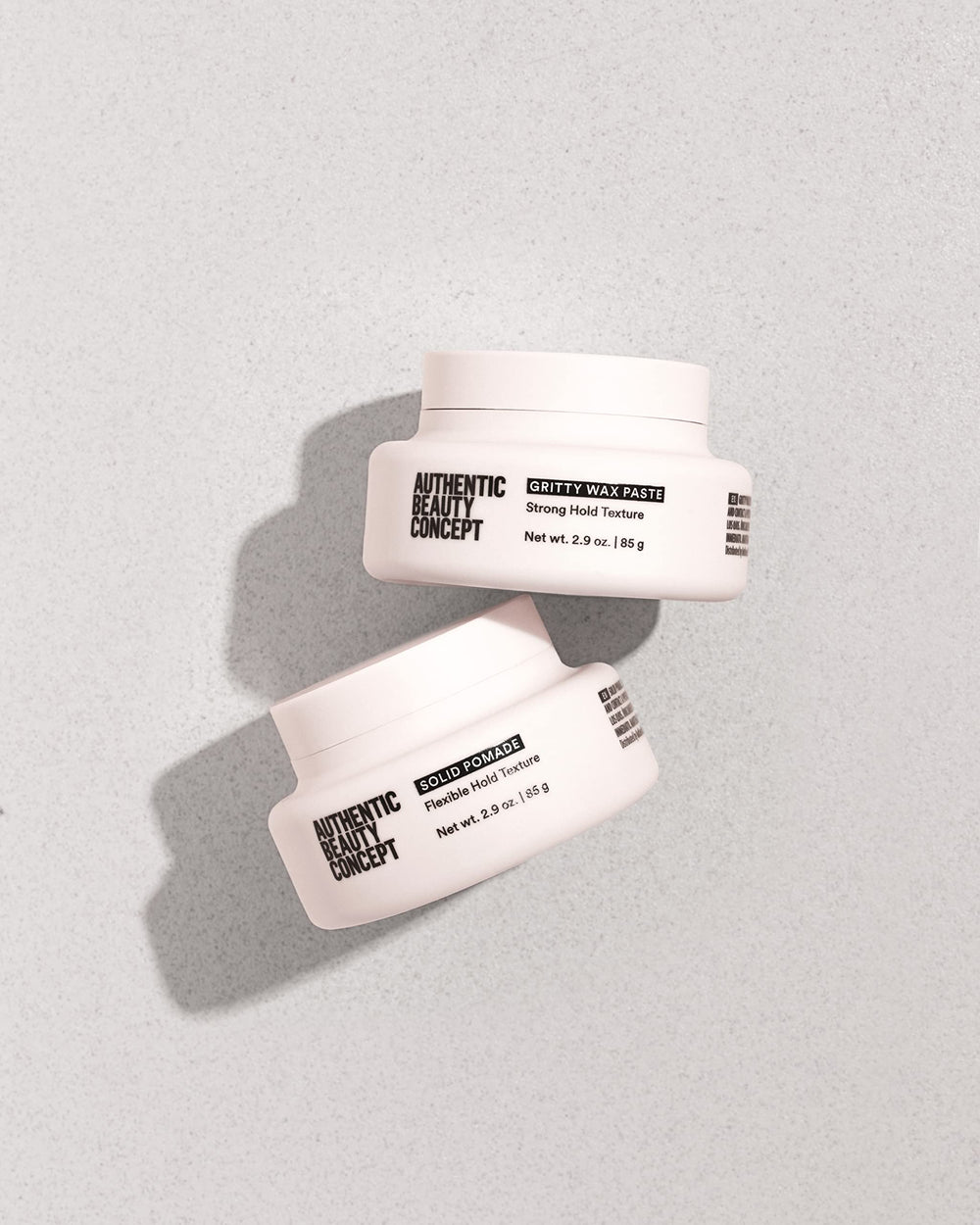Ingredients vegan and cruelty-free label on Authentic Beauty Concept Solid Pomade packaging.