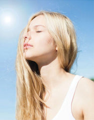 AVON Haiku Reflection woman enjoying scent, ideal for daily rituals and calm moments.