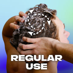 Hands massaging AXE Apollo 2-in-1 to soften and refresh hair.