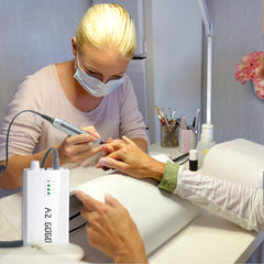 AZ GOGO handpiece shown connected to charger for portable setup.