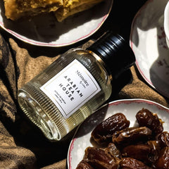 Azha Arabian Tea House luxury bottle stand elevates fragrance display.