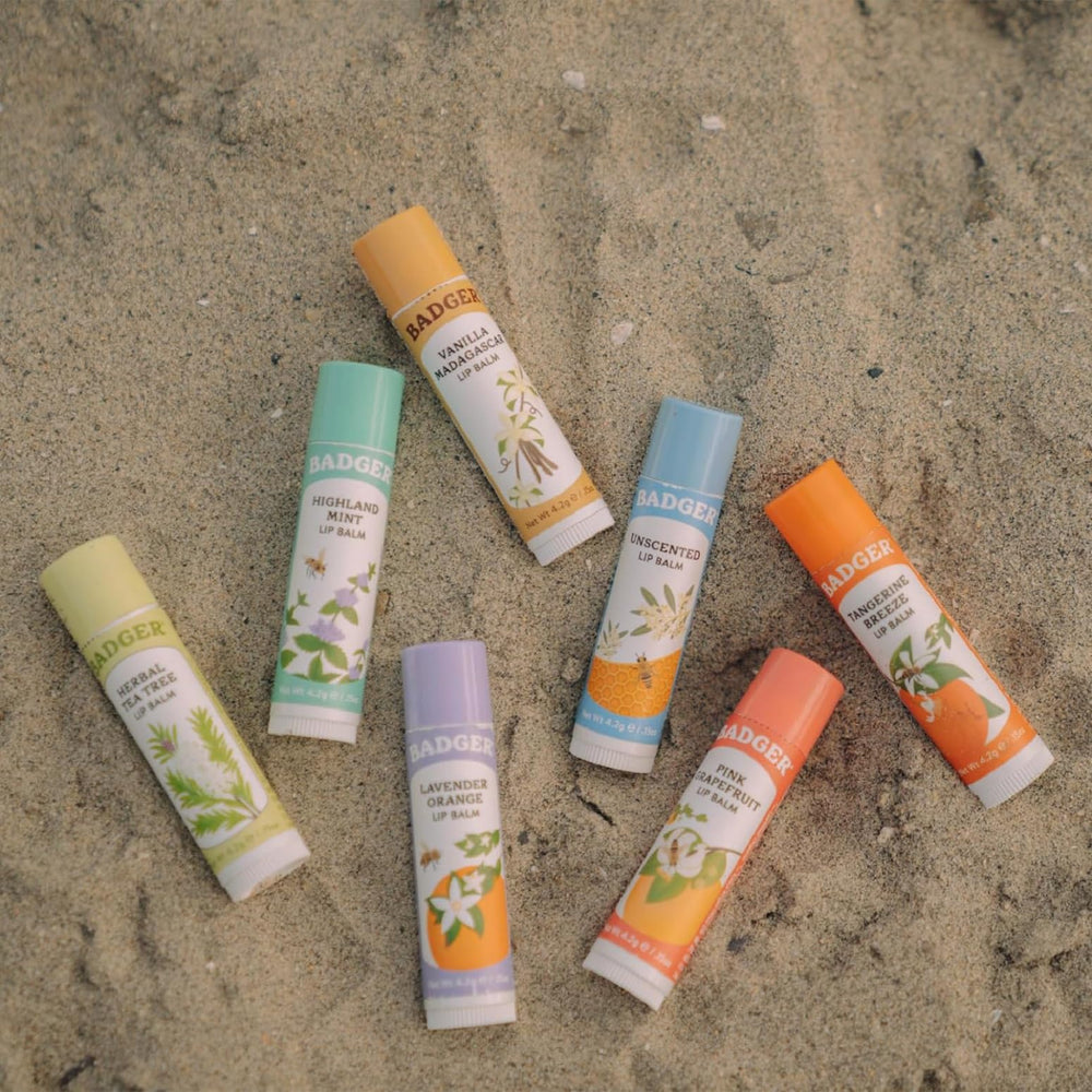 Mint leaves beside Badger balm emphasizing refreshing scent and cooling feel