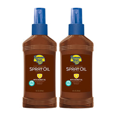Banana Boat Deep Tanning Spray Oil SPF 4 on a sunny beach for easy sun care.