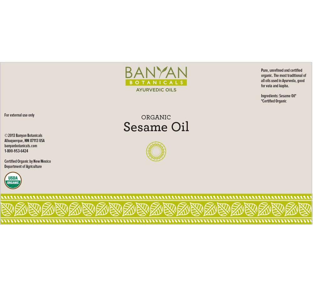 Close-up pour spout on Banyan Botanicals sesame oil for easy use.