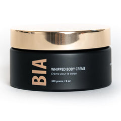 Bare It All whipped body creme jar close-up showing rich hydration-ready texture.