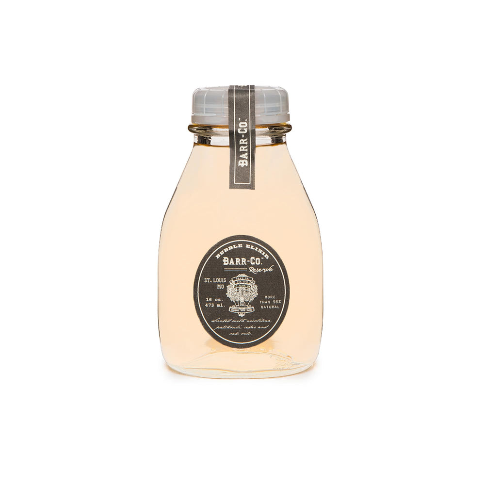 Barr-Co Reserve Bubble Bath Elixir bottle with earthy aroma for a calming soak.