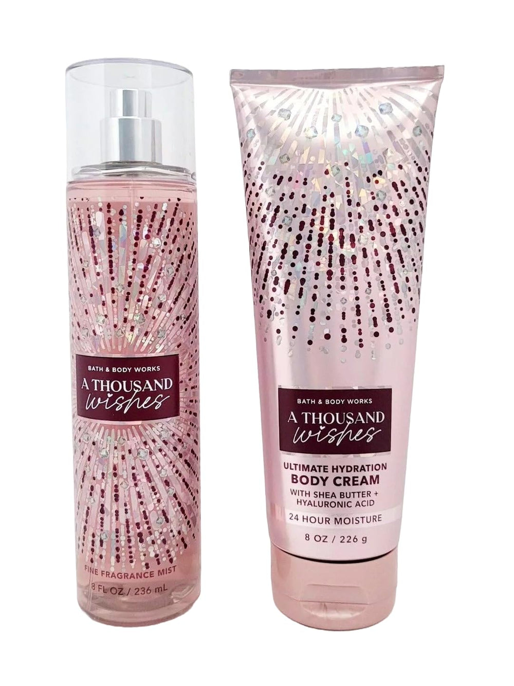 Bath & Body Works Thousand Wishes Fine Fragrance Mist bottle on iridescent pink packaging for long lasting scent