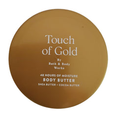 Bath and Body Works Touch of Gold whipped butter being applied for smooth skin