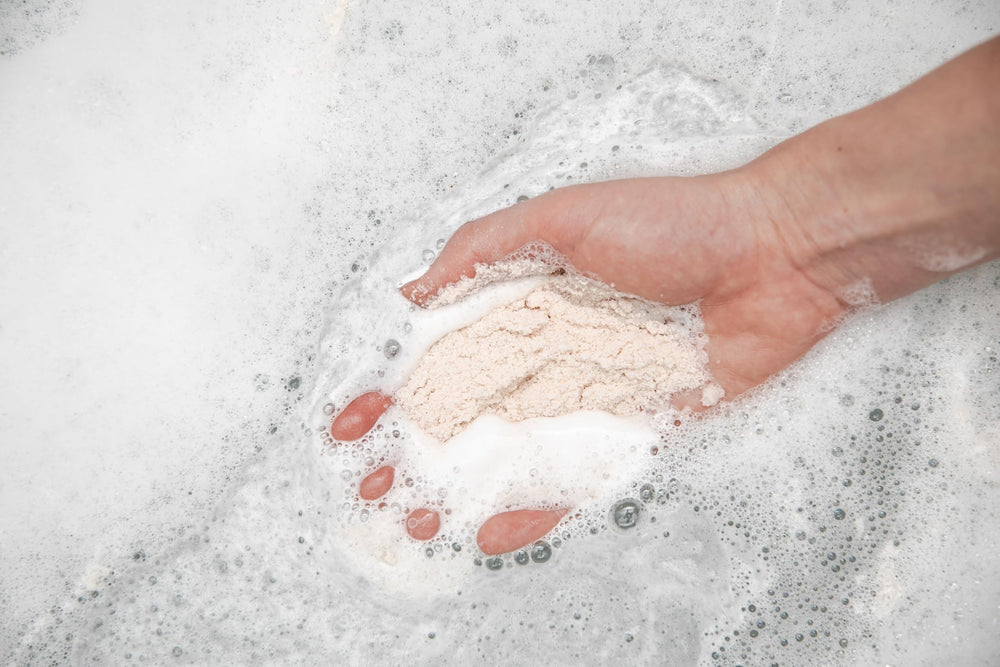 Kaolin clay and mineral blend forming a spa-like crema in the tub