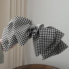 BBTDIN buffalo plaid bow clip ideal for holiday looks.