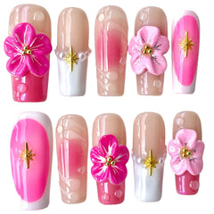 BByogooz pink Sakura 3D nails closeup highlighting delicate blossoms and a glossy finish